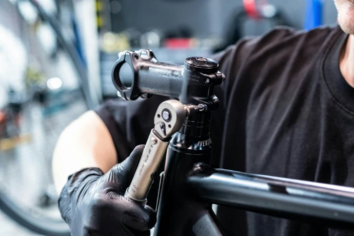 a close up of a person holding a bike